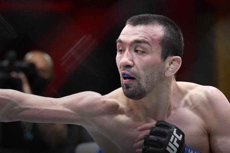 Askar Askaarov of Russia punches Joseph Benavidez in their flyweight fight during the UFC 259 event at UFC APEX on March 06, 2021 in Las Vegas, Nevada. (Photo by Chris Unger/Zuffa LLC)